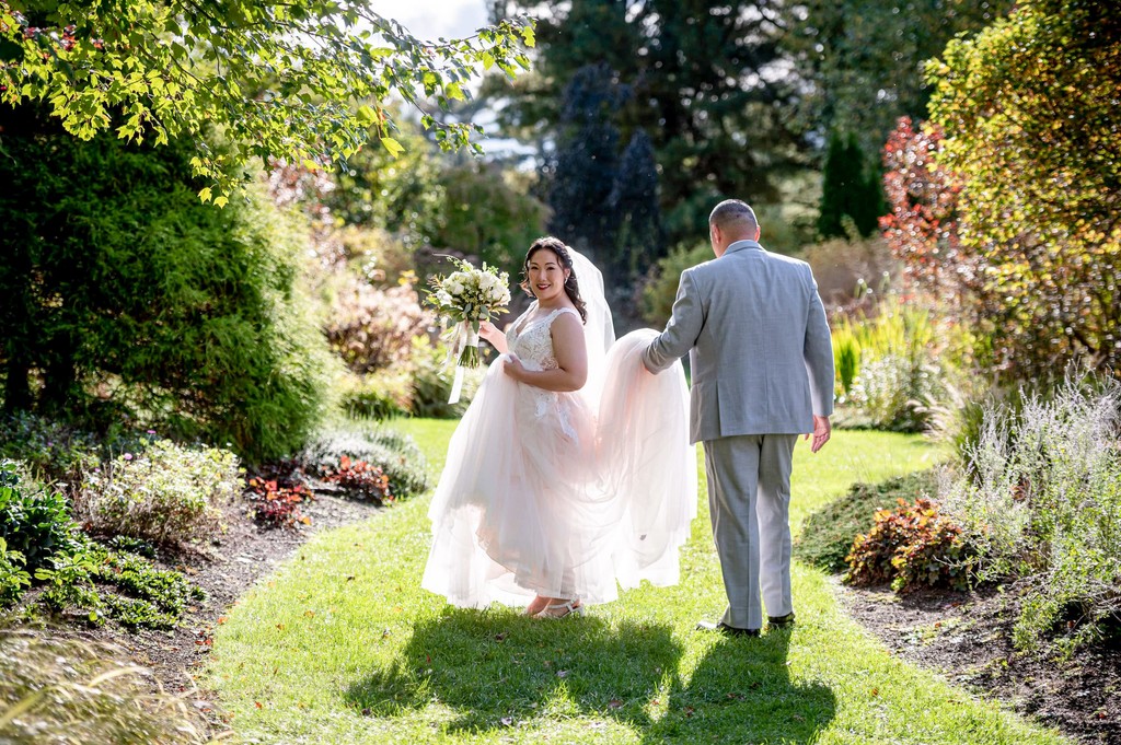 Bride and groom walking together at Elm Bank