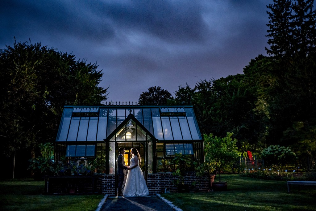 Elm Bank wedding greenhouse glowing at night