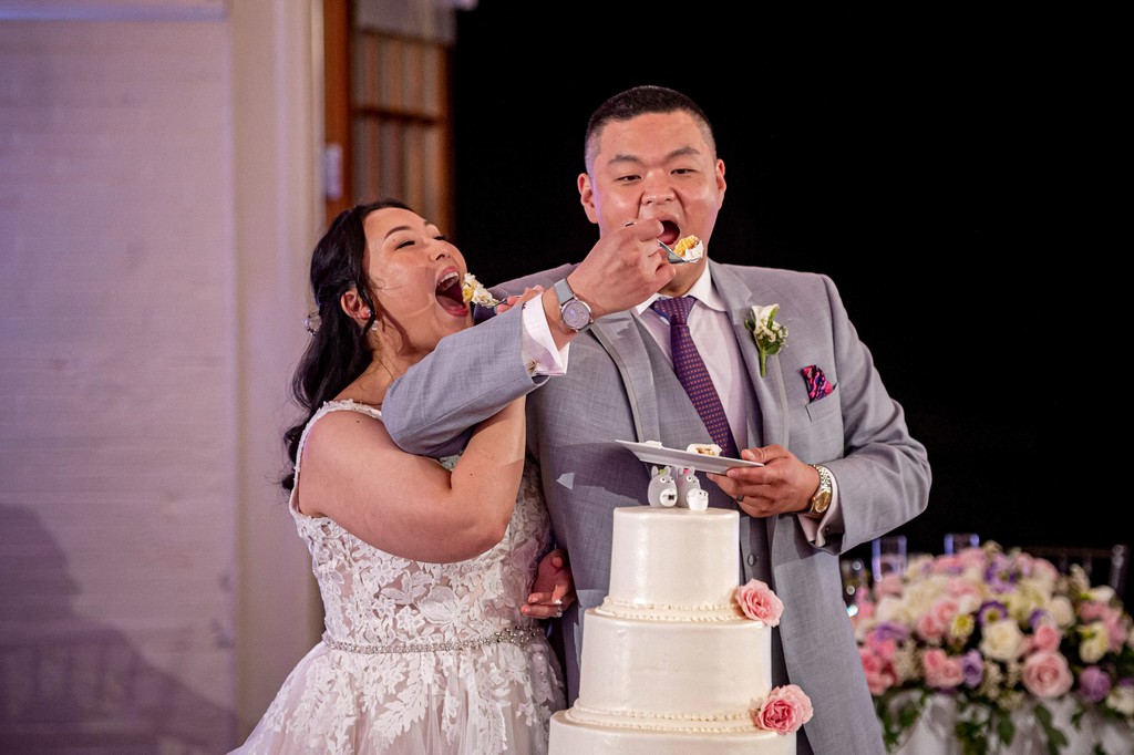 Elm Bank wedding reception silly cake cutting moment