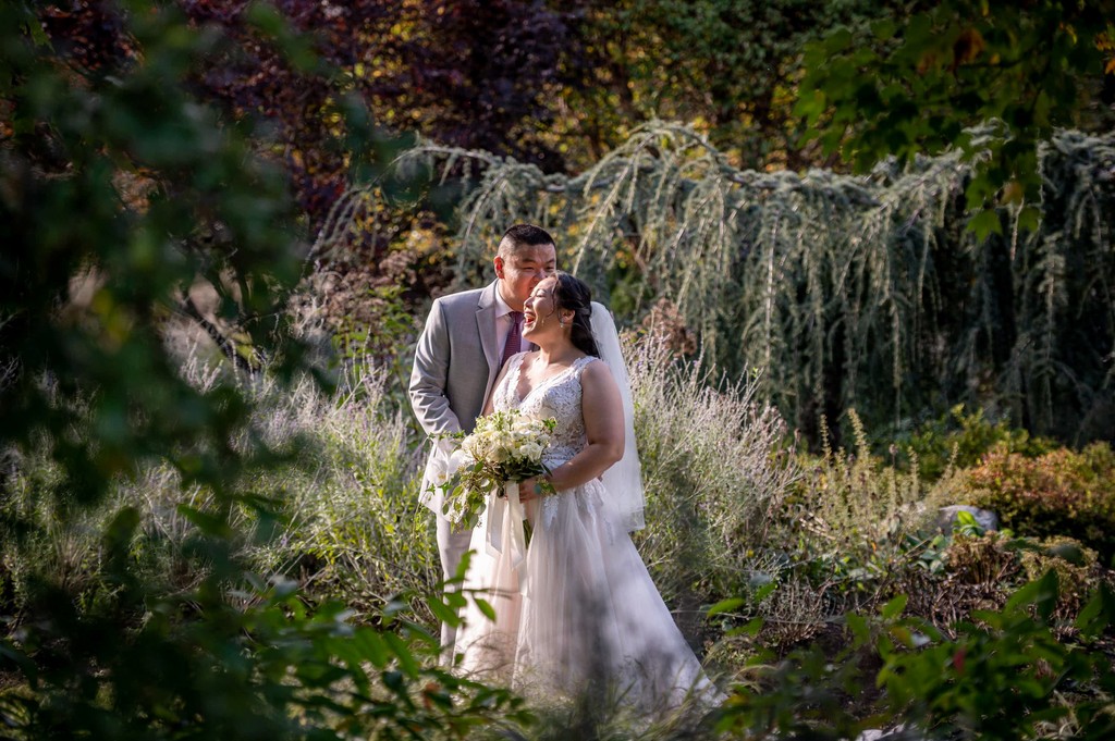 Romantic wedding portrait under willow trees at Elm Bank