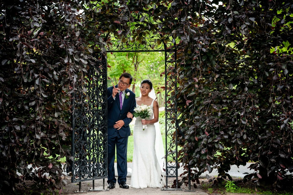 Bride and father pre-ceremony at the ivy-covered gate at Elm Bank wedding