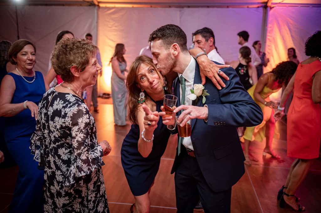 Packed dance floor at Elm Bank wedding reception with guests celebrating