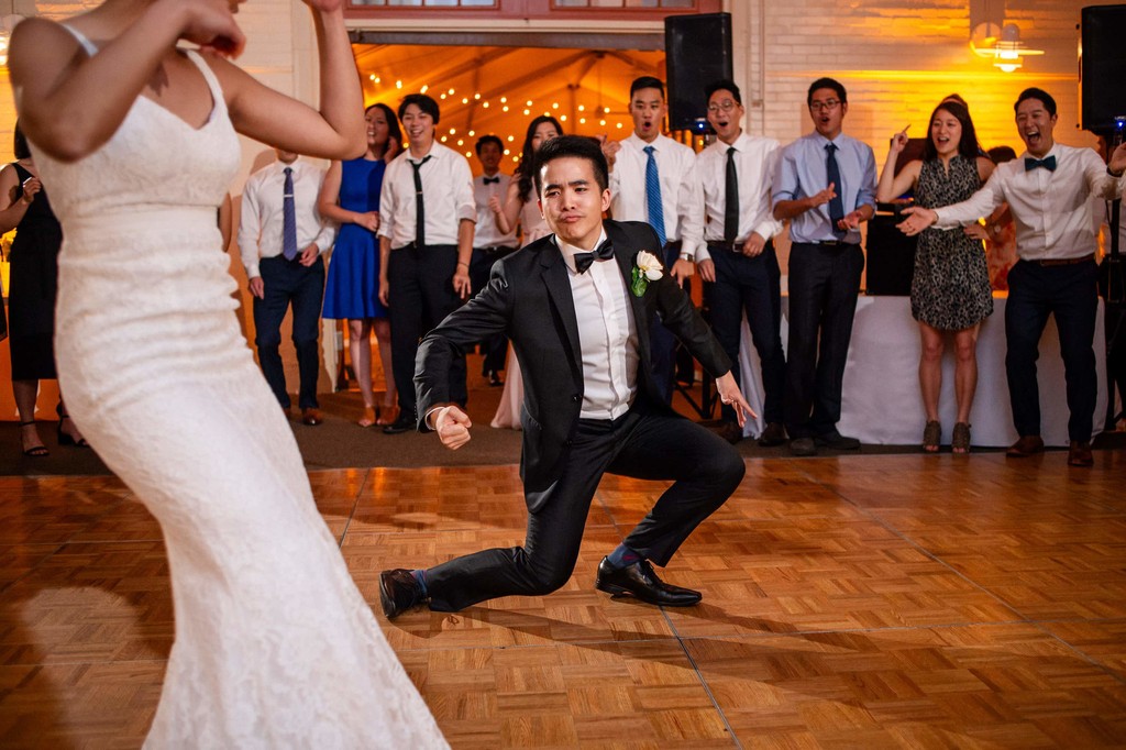 Groom enthusiastically dancing with bride at an Elm Bank wedding