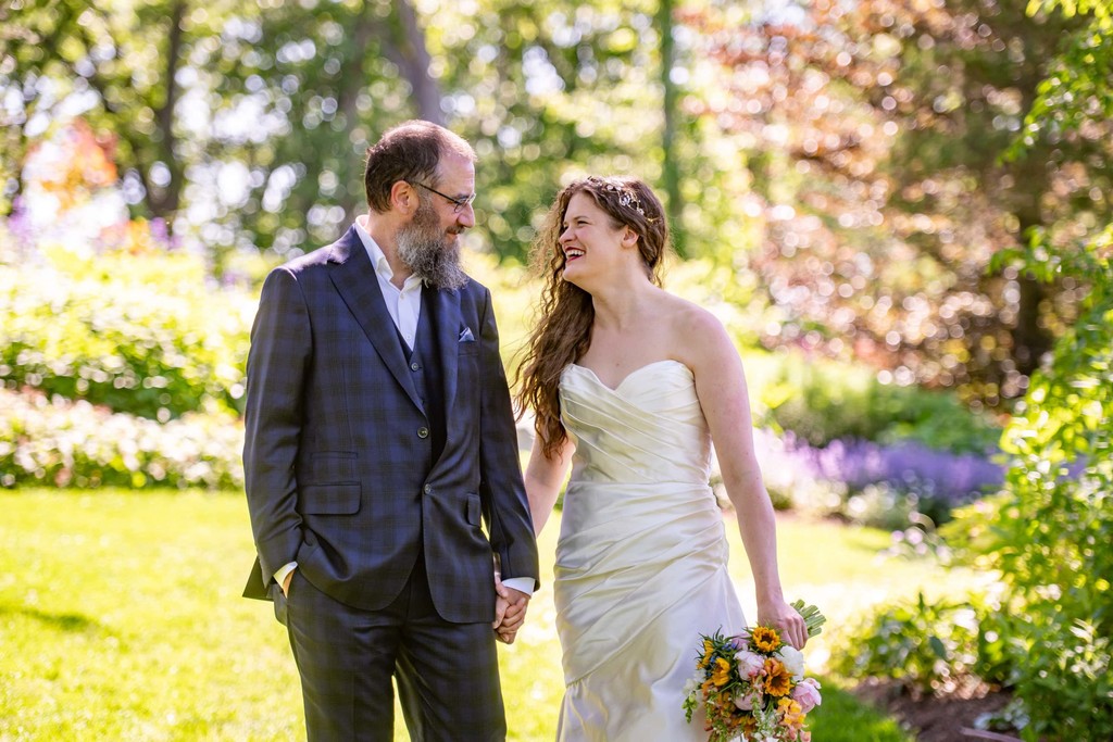 Bride and groom walking hand in hand at Long Hill Beverly wedding