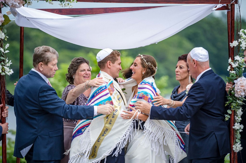 Jewish ceremony Sheva Brachot joyful bride surrounded by family