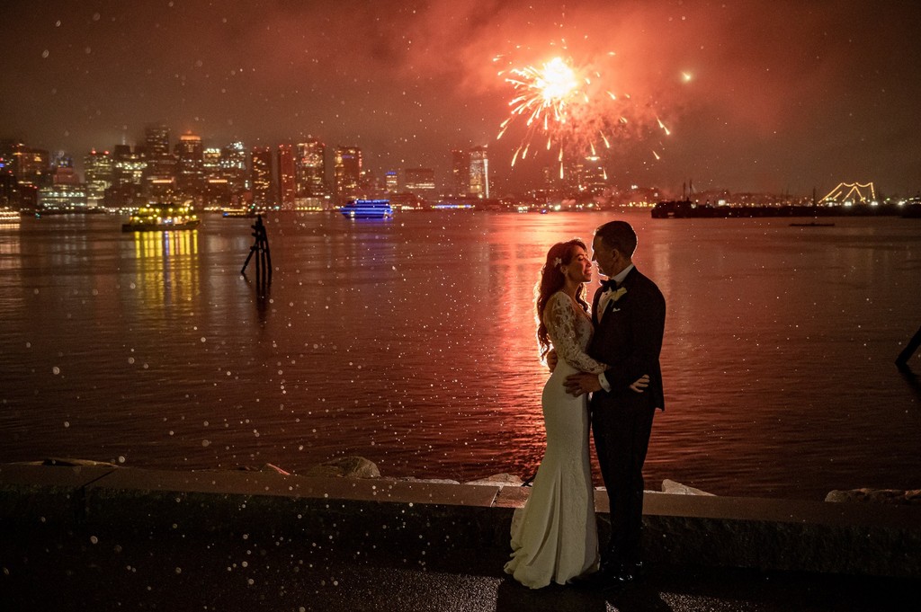 Epic wedding couple fireworks kiss over the Boston Harbor