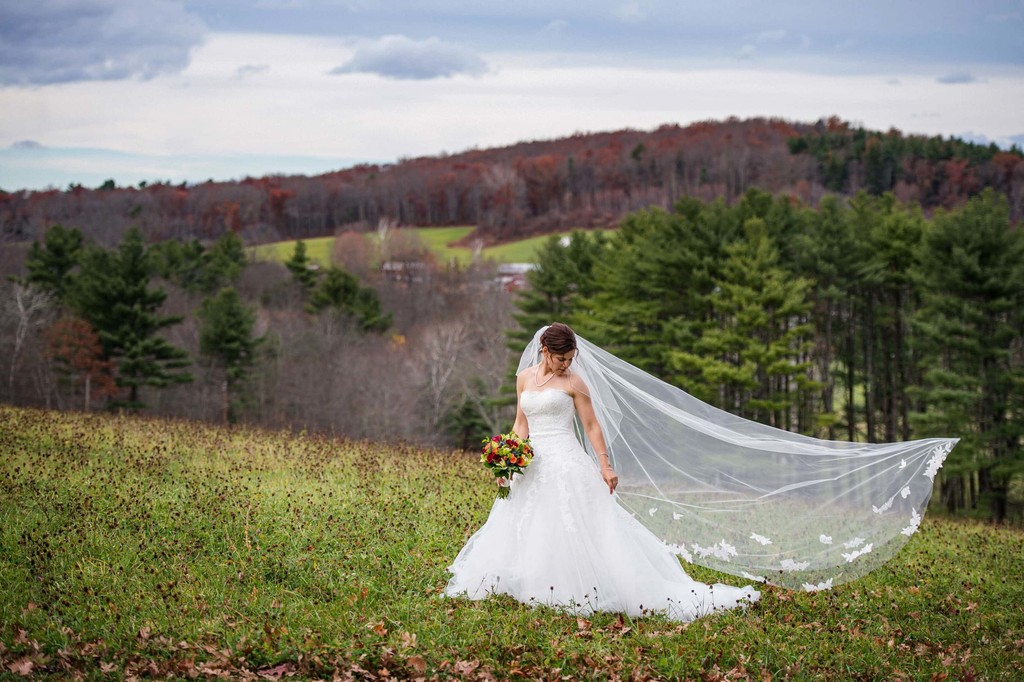 Windswept bridal portrait at Fern Hill Barn