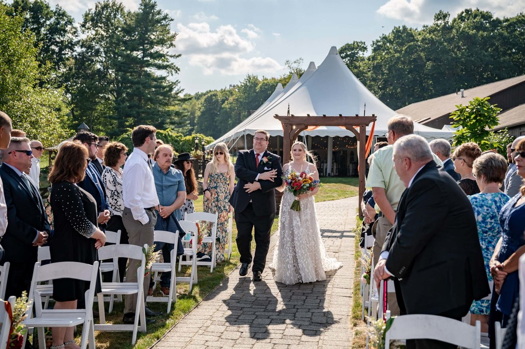 Bride and her dad walking down the aisle at Fern Hill Barn
