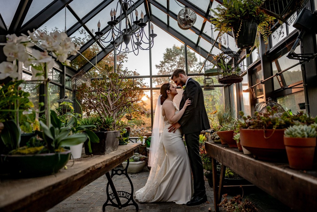Sunset greenhouse wedding portrait at Fern Hill Barn