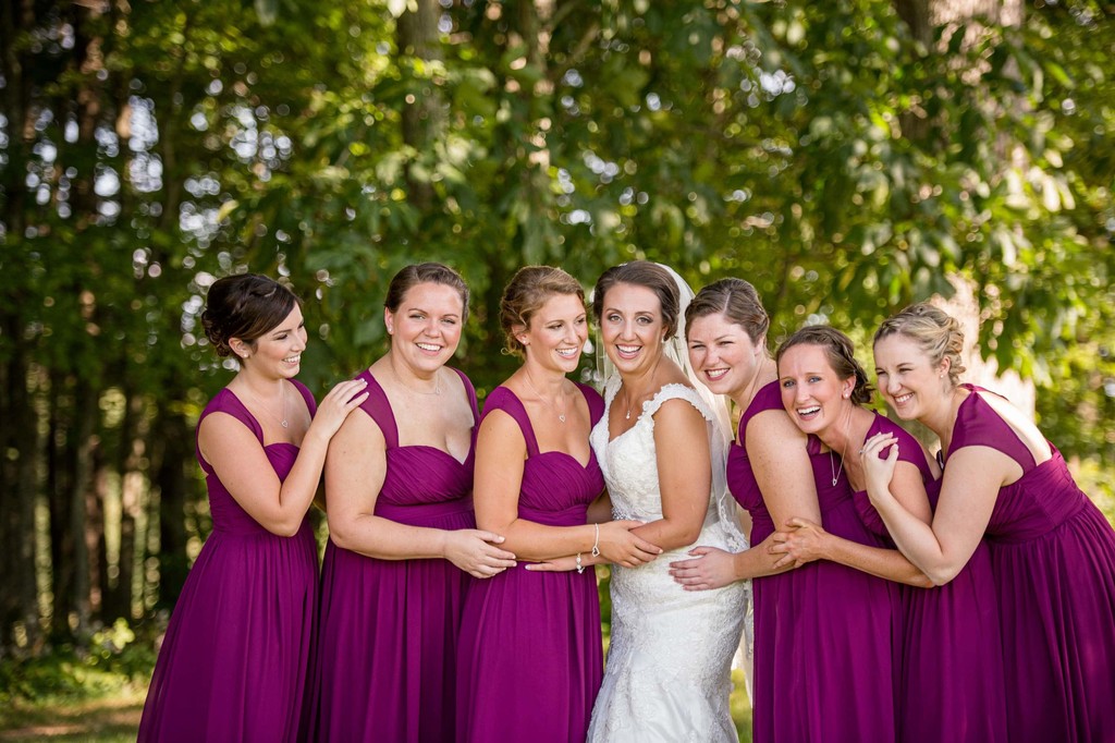 Bridesmaids laughing in purple dresses – Fern Hill Barn