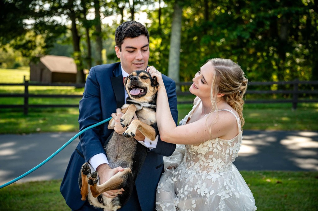 Couple with their dog in wedding attire – Fern Hill Barn