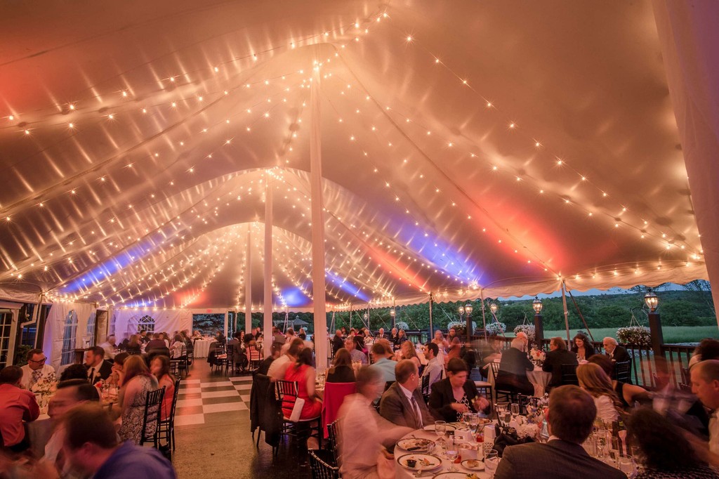 Vibrant tent lighting during the Fern Hill Barn reception