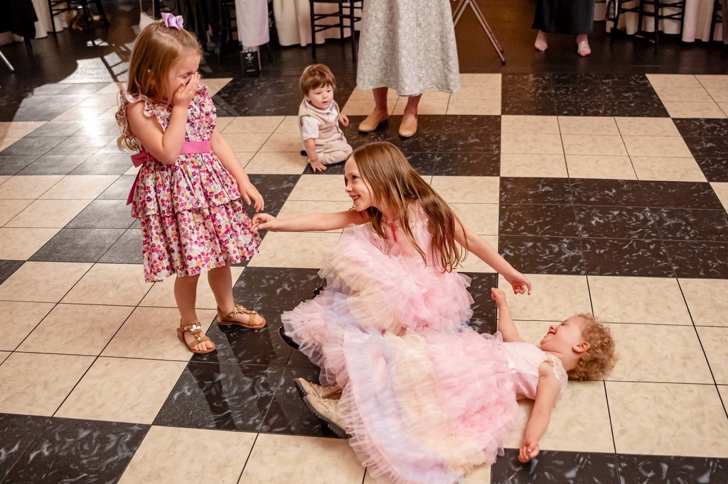 Kids dancing on checkered floor – Fern Hill Barn reception