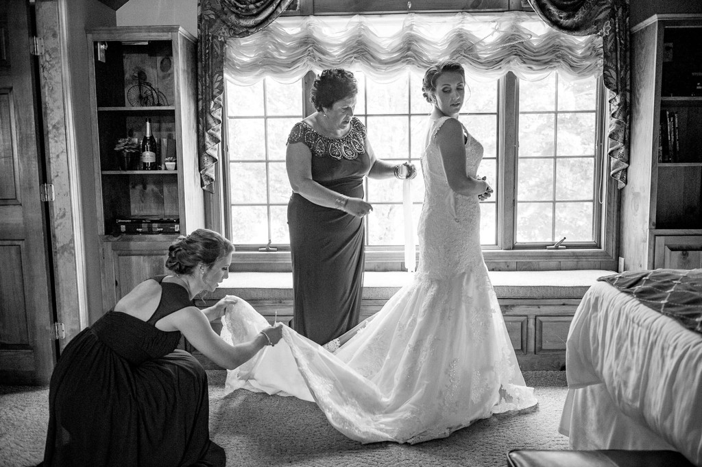 Bride getting dressed – black & white at Fern Hill Barn