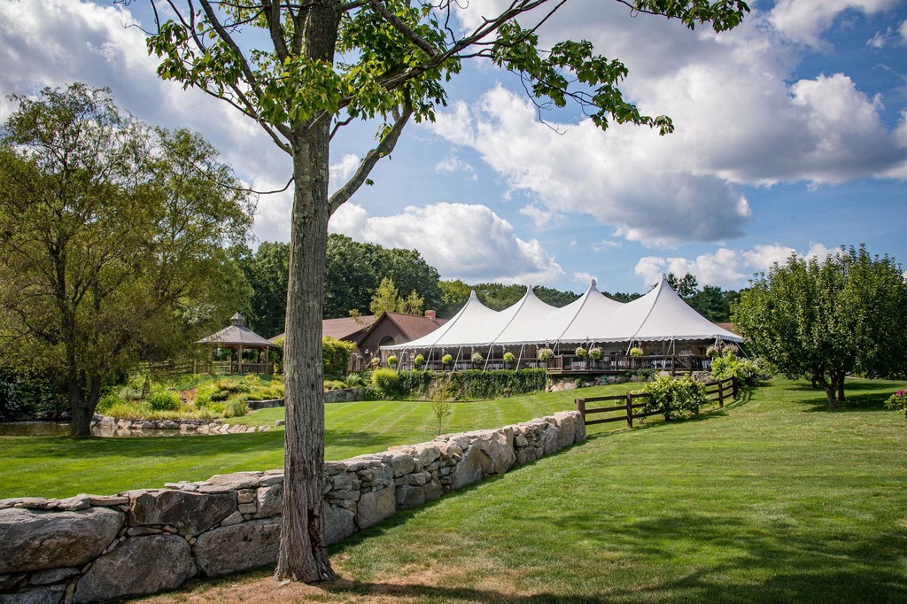 The grandeur of Fern Hill Barn view from the stone wall