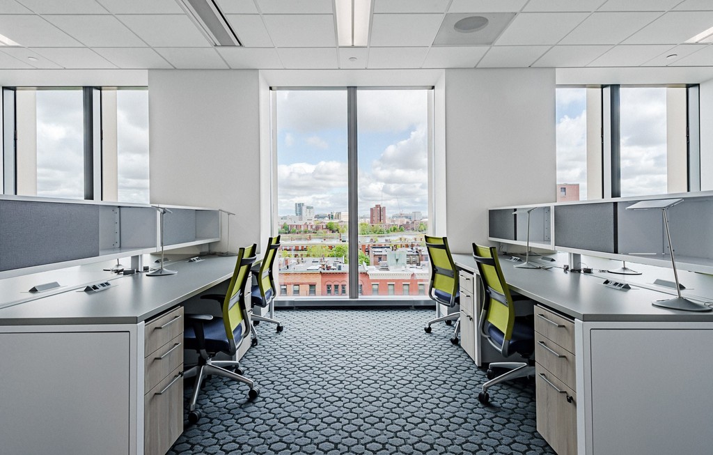 Open office with cubicles and window views Boston