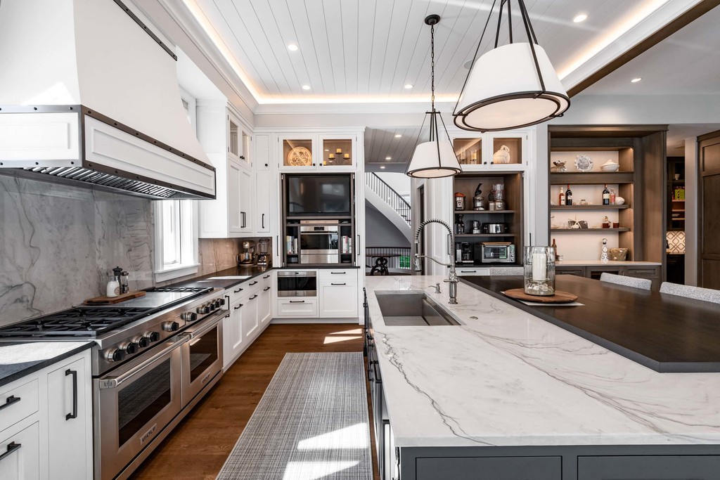 Modern white and wood kitchen with marble island