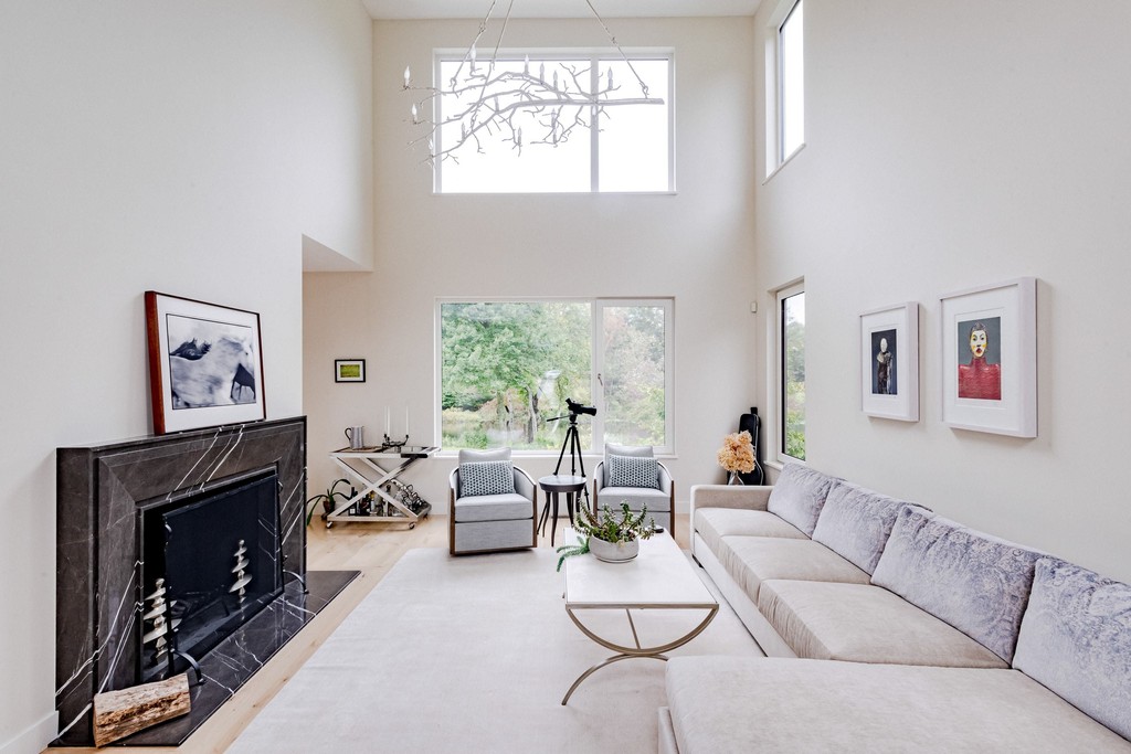 Bright open concept living room with large windows
