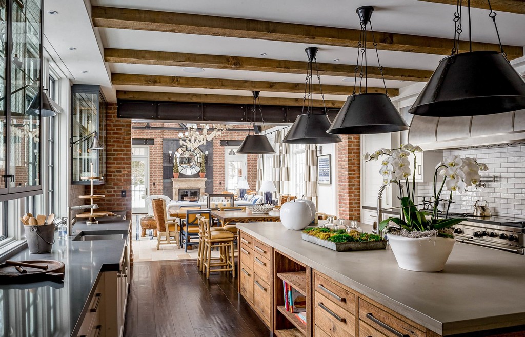 Grand farmhouse style kitchen with concreate countertops