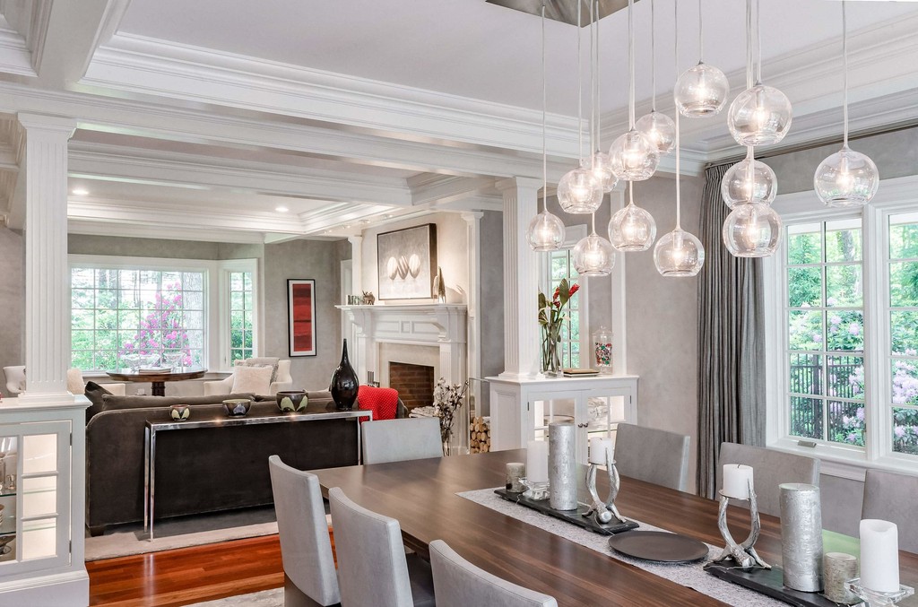 Formal dining room with tray ceiling and pendant lights