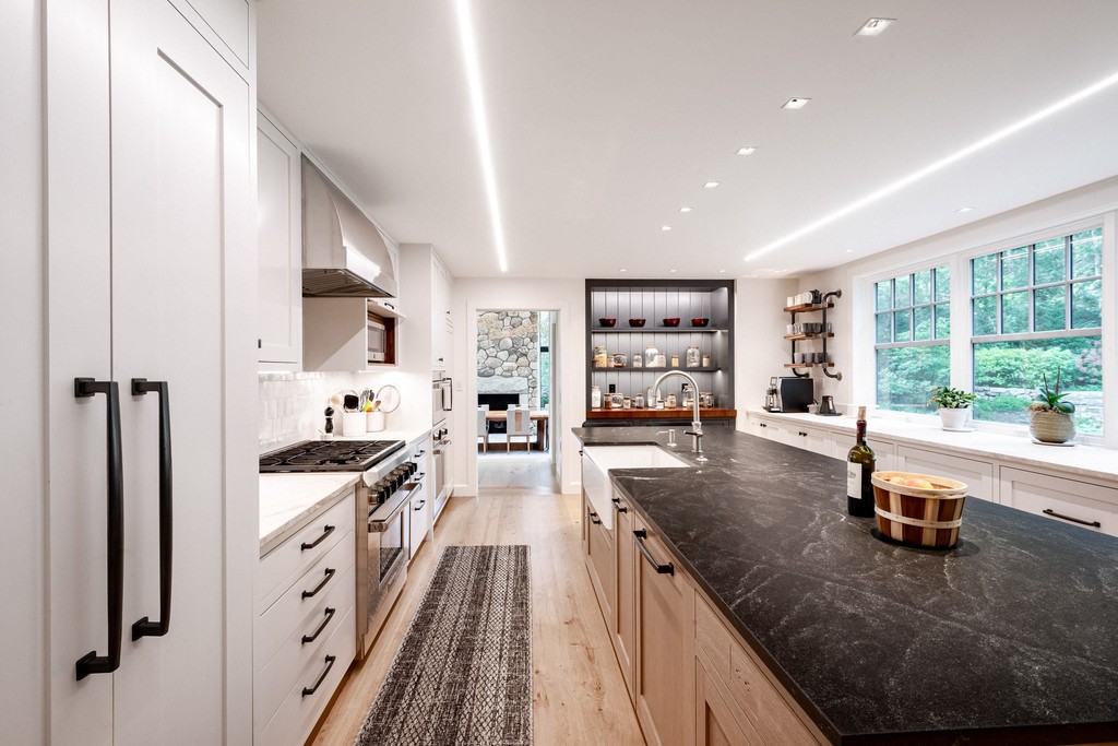 Bright modern kitchen with wood accents dark countertops