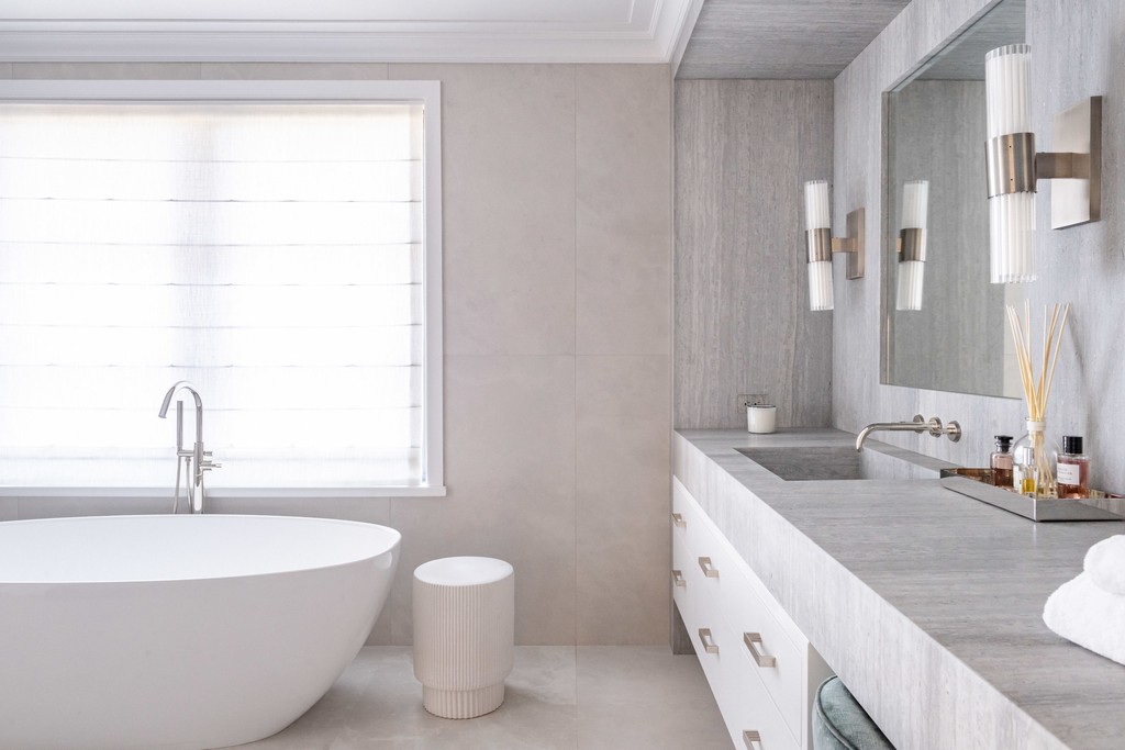 Luxury bathroom with freestanding tub and marble vanity