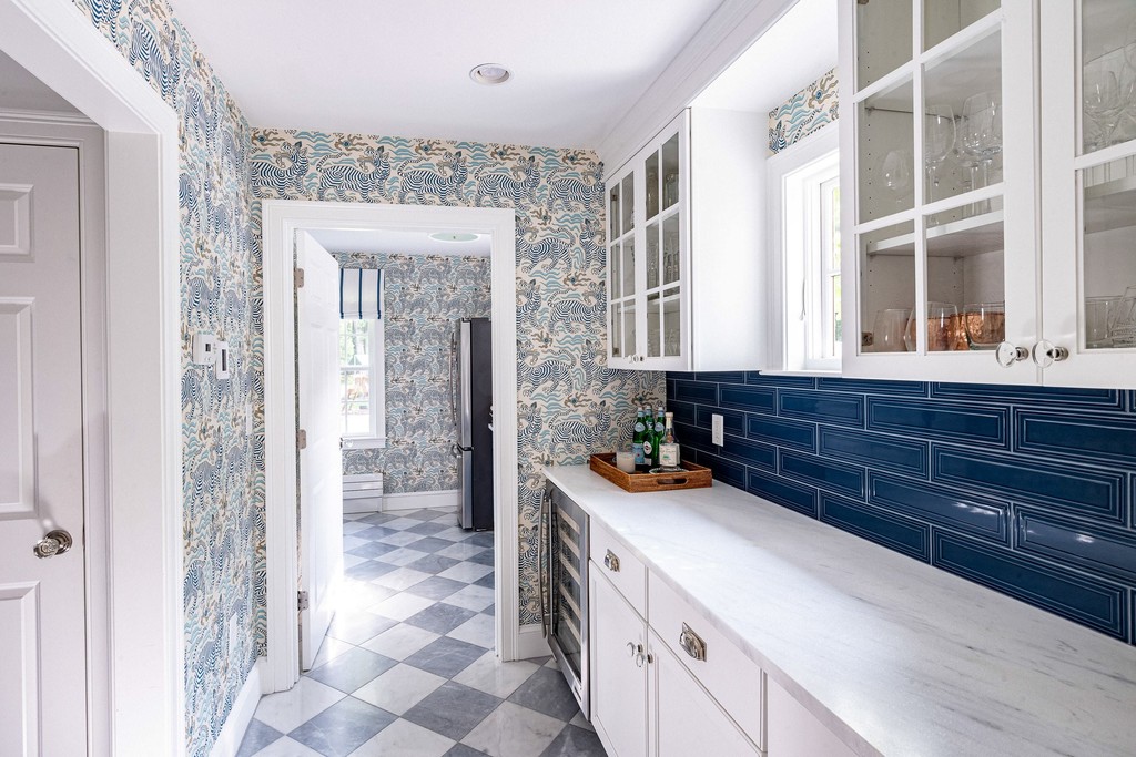 Blue and white floral wallpaper in a modern pantry