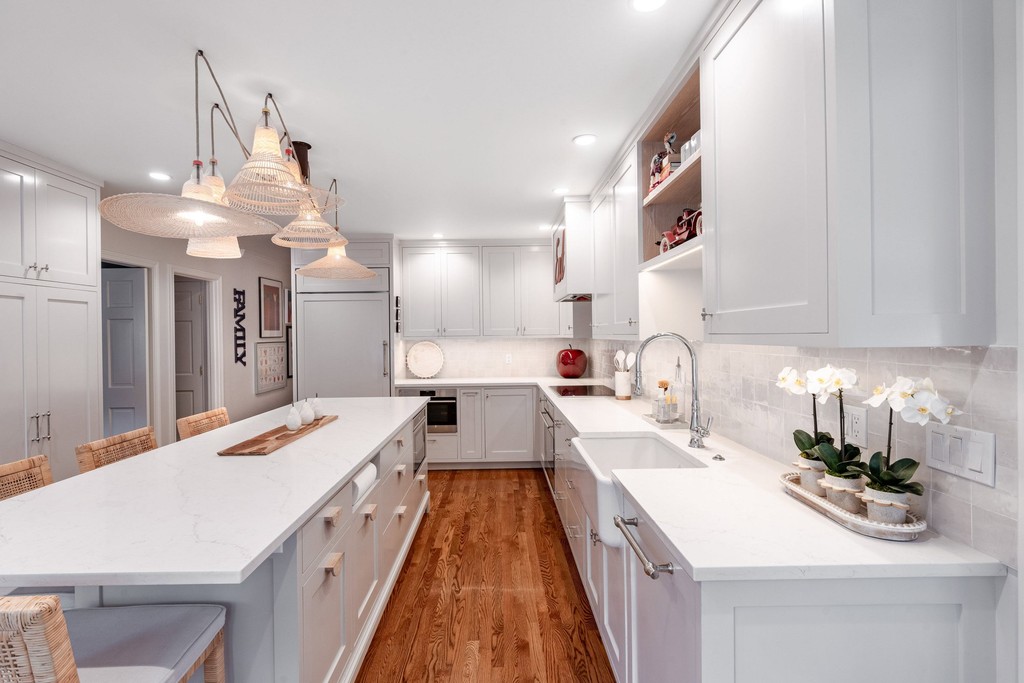 Bright kitchen with glass cabinets and island seating