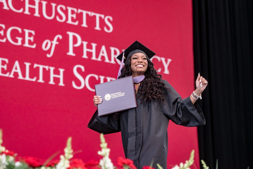 Joyful graduate moment captured by Boston photographer