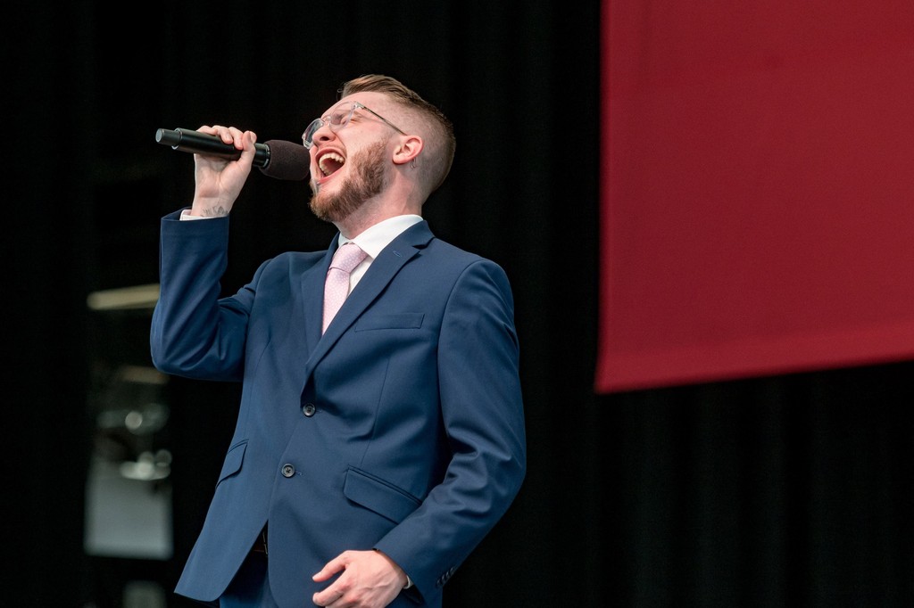 Dynamic corporate singer performing at Leader Bank Pavilion