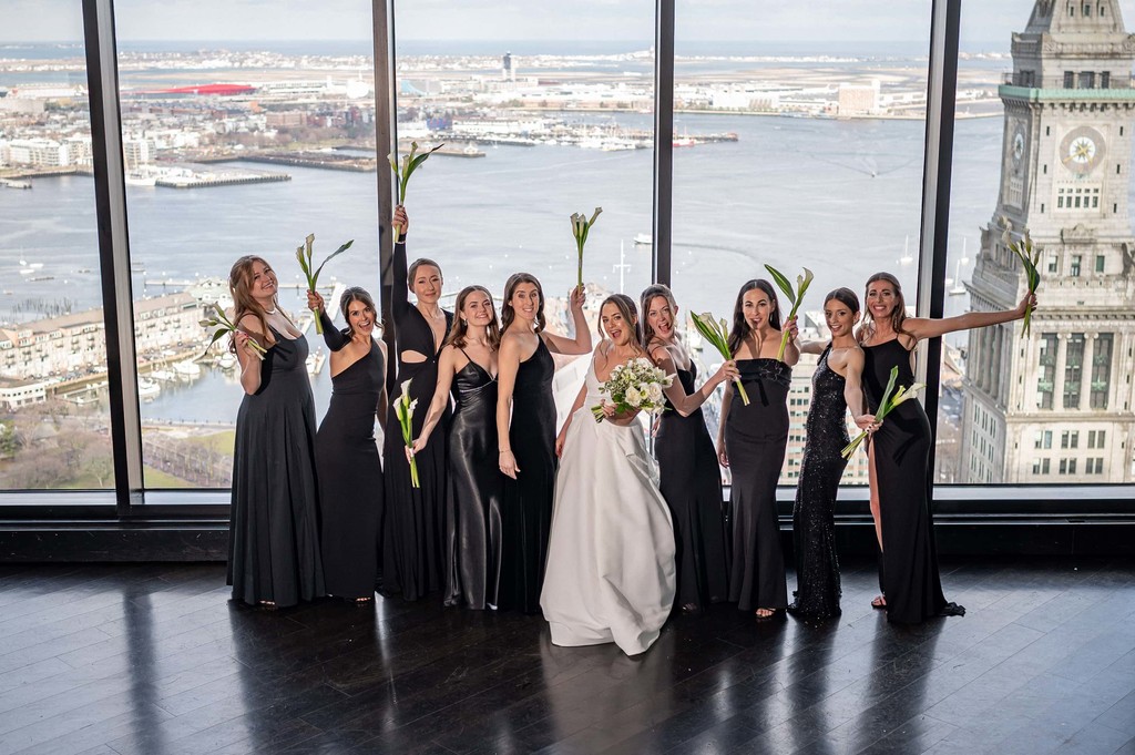 Wedding party portrait with Boston skyline