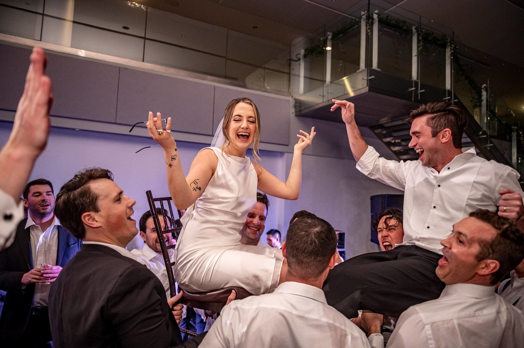 Bride lifted up in hora during Boston wedding