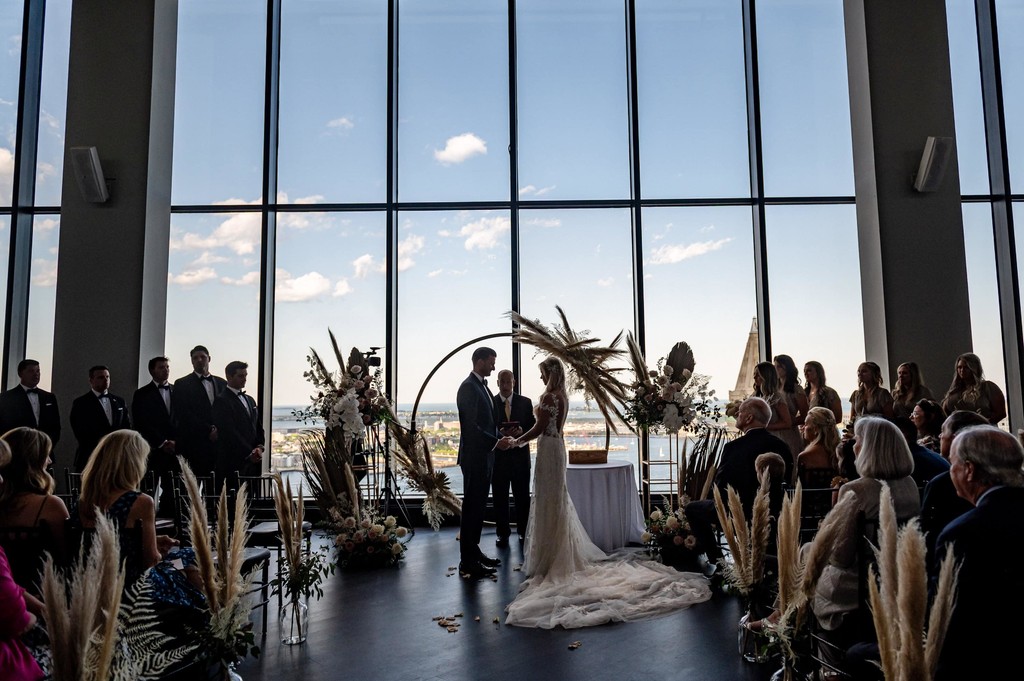 Dramatic sillouette of wedding ceremony State Room Boston