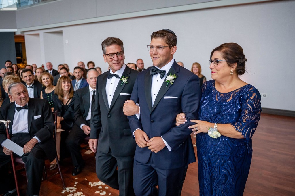 Groom with family as ceremony begins