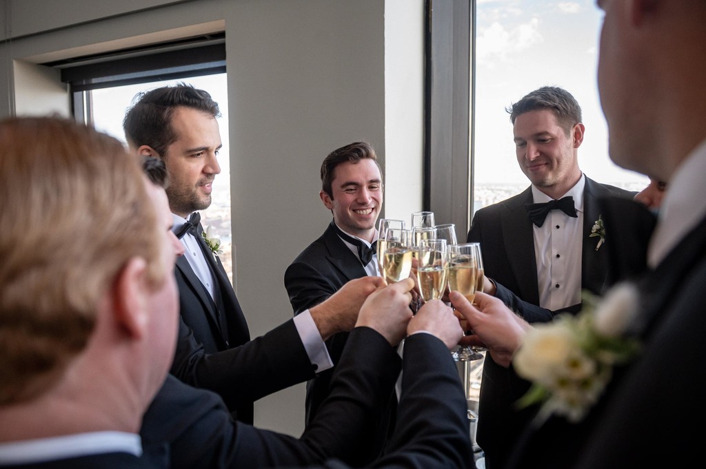 Groomsmen toasting before the wedding