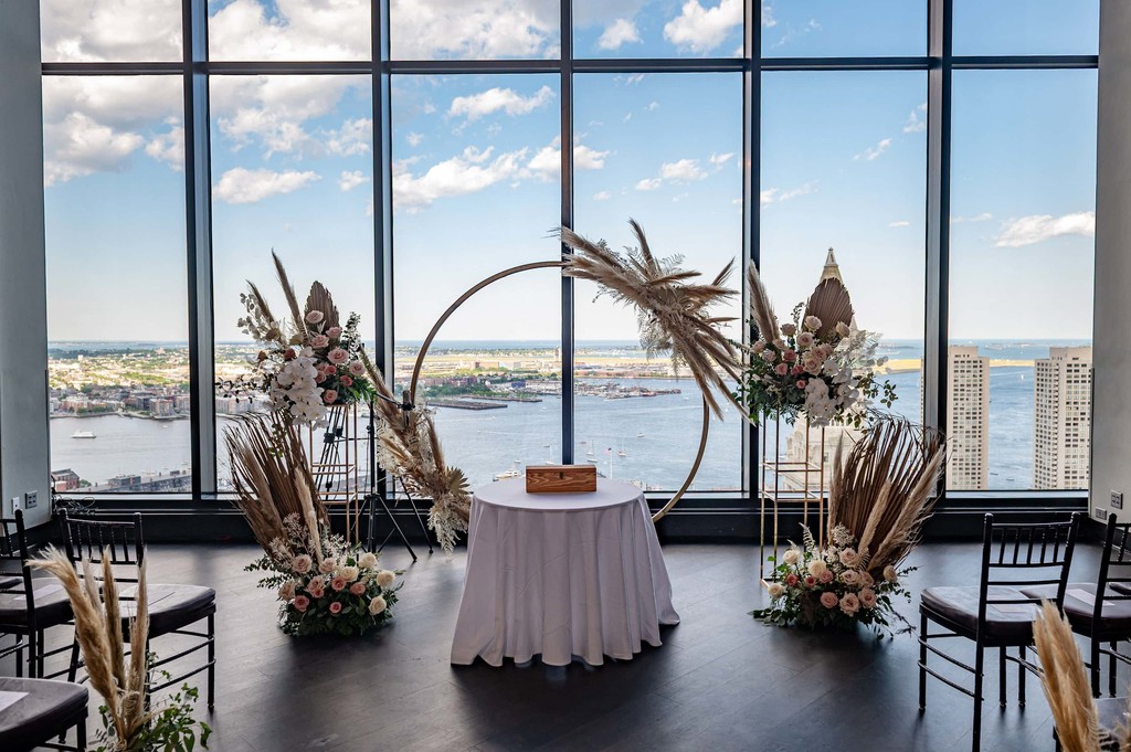 Minimalist ceremony setup with city view