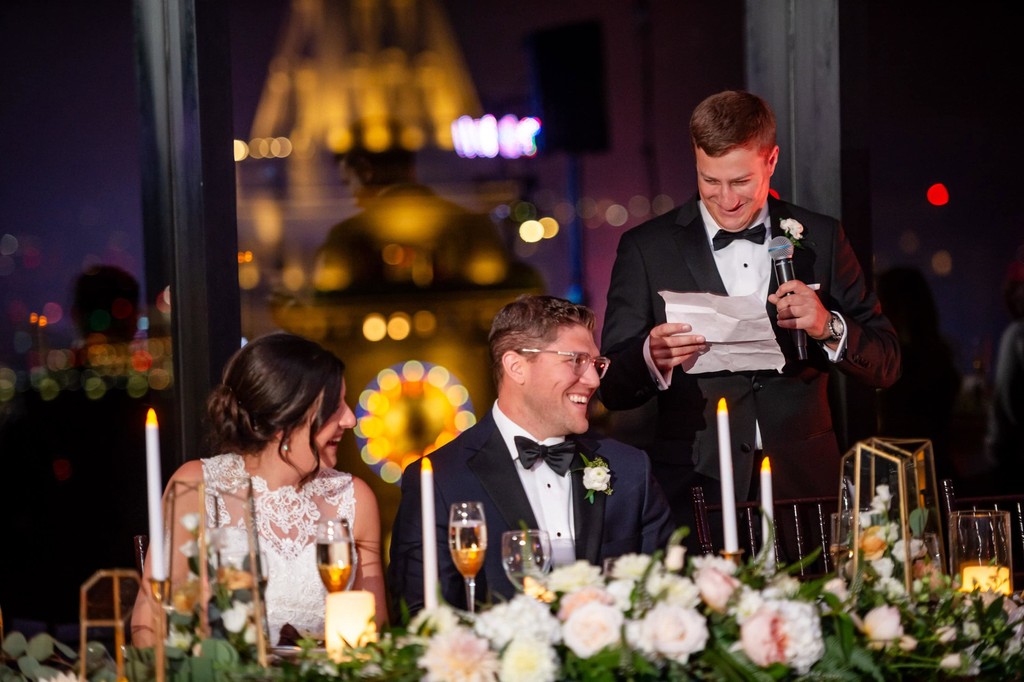 Couple laughing at the best man's speech