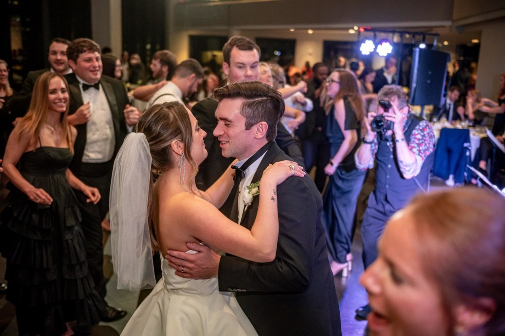 Couple’s first dance surrounded by guests