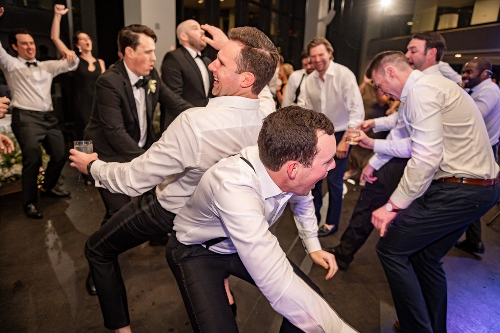 Groomsmen breaking it down on the dance floor