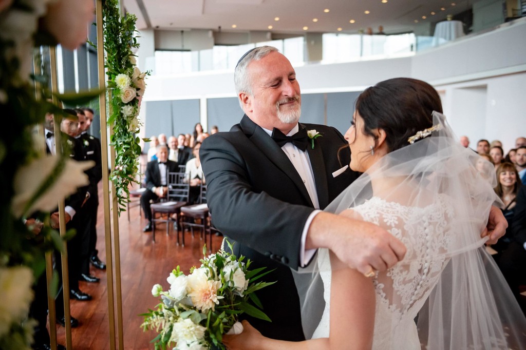 Bride unveiled by her dad at the start of the ceremony