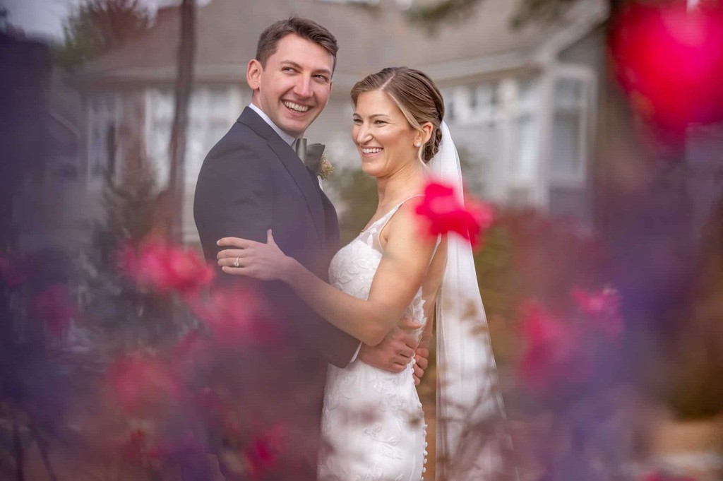 Laughing couple among the flowers at Willowbend