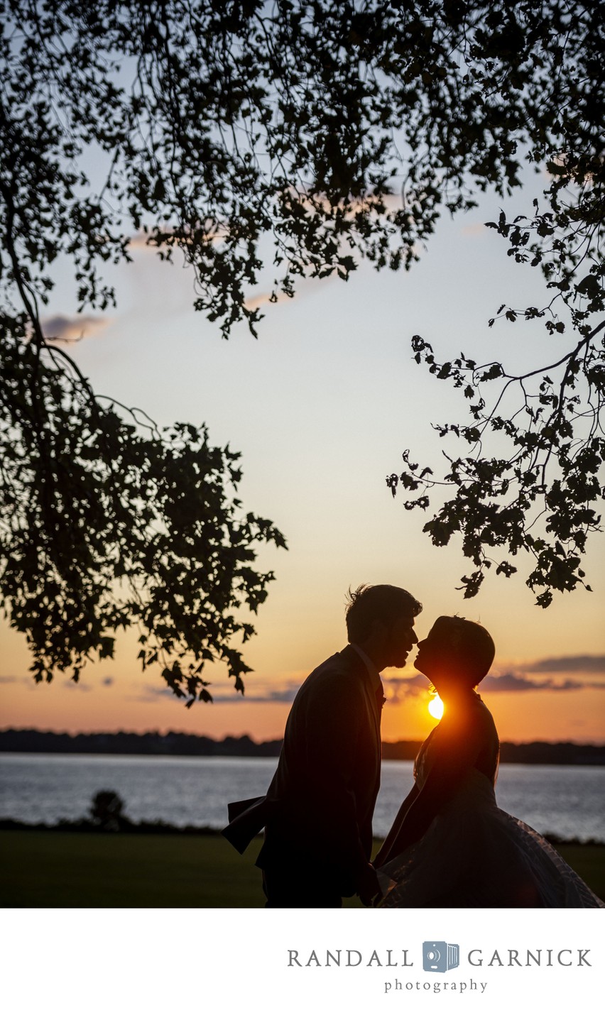 Golden hour kiss Blithewold Mansion wedding couple