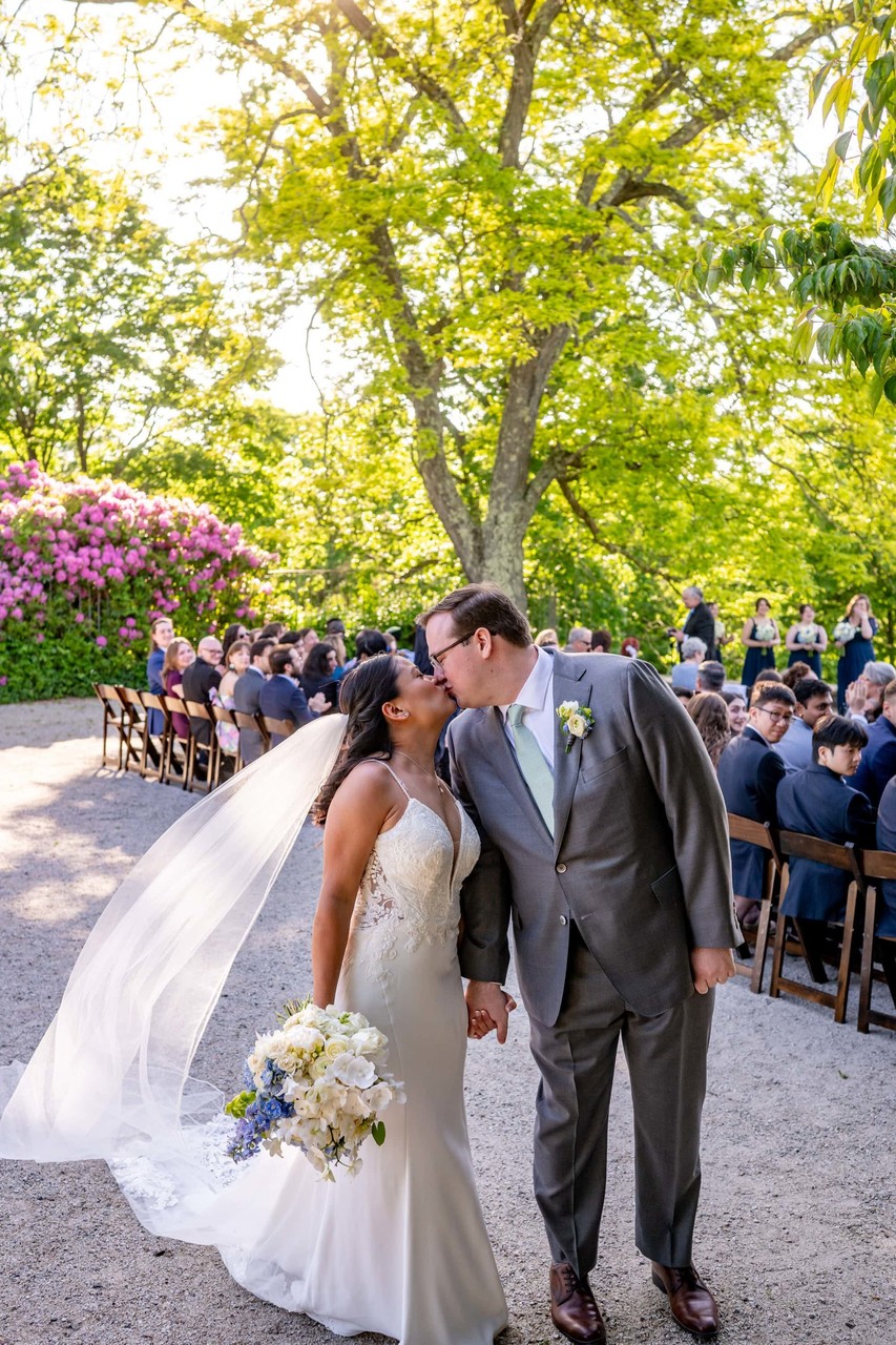 Bride and Groom Kiss Under Trees at deCordova Museum Weddings