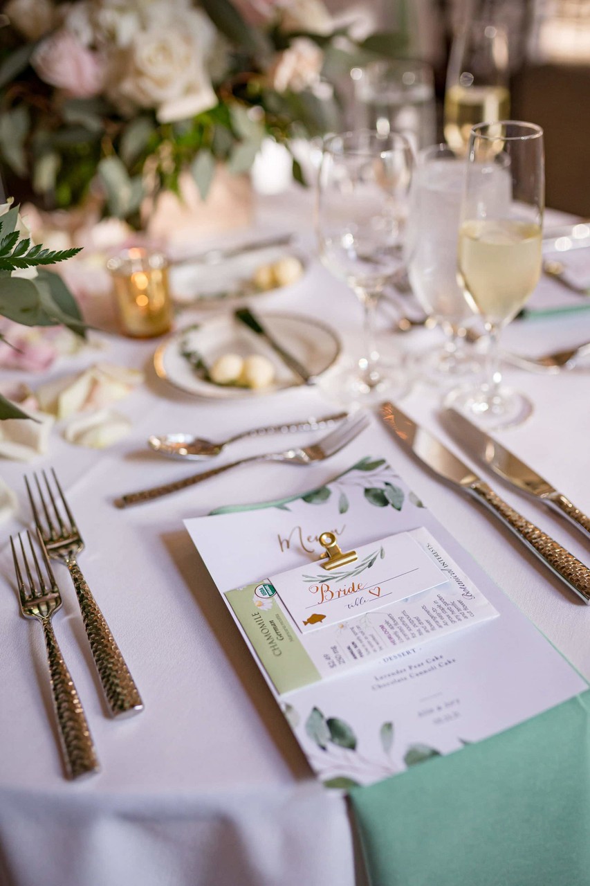 Elegant table setting with floral details at Elm Bank wedding reception