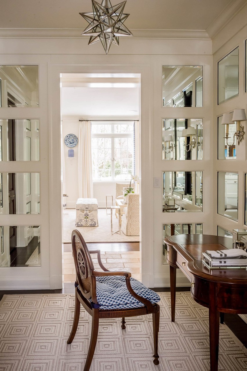 Transitional sitting area with natural light and glass doors