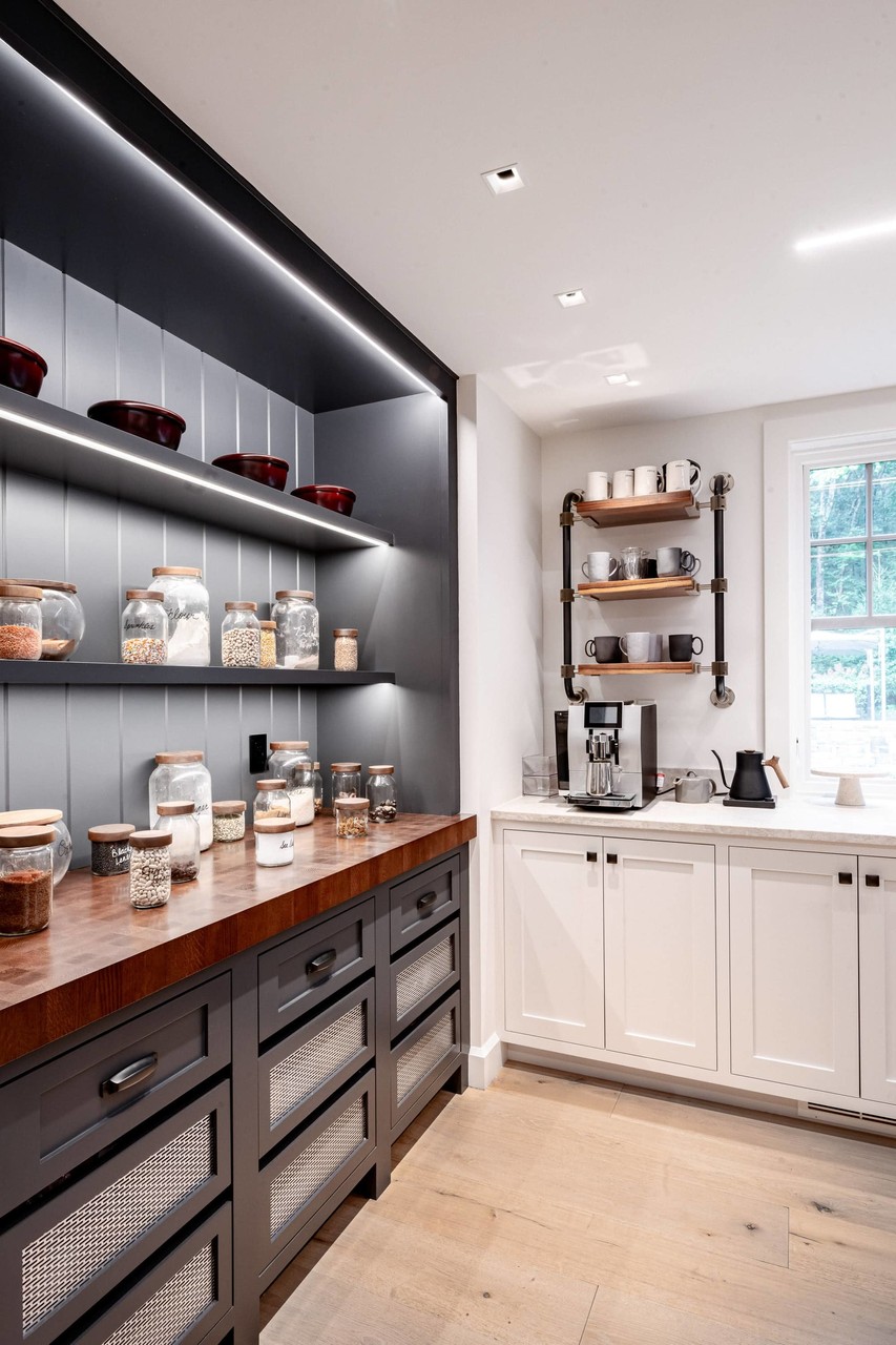 Pantry with floating shelves, built-in cabinetry and coffee bar