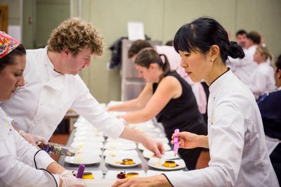 Joanne Chang of Flour Bakery prepares food at charity event