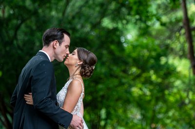 Bride and groom garden kiss Blithewold Mansion wedding