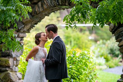 Romantic garden kiss Blithewold Mansion wedding couple