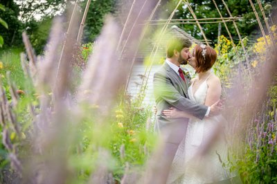 Garden embrace Blithewold Mansion wedding couple